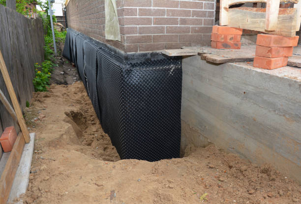 SJ Waterproofing Pros technician performing targeted Waterproofing assessment in Lewistown, IL